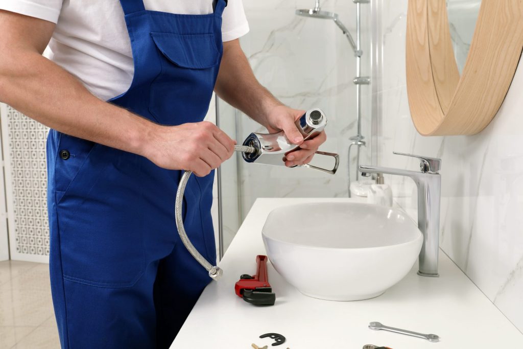 plumber installing sink